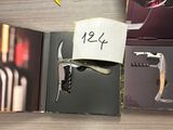 a wine bottle and a cork opener on a table