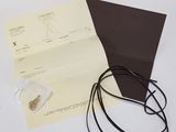 a piece of paper with a string attached to it