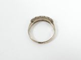 a close up of a ring on a table with a white background