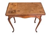 an image of a wooden table with a floral design on it