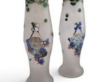 two vases that have been decorated with flowers and birds