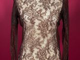a mannequin dress with a black and white lace top