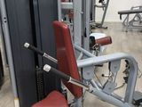 a gym room with machines and other equipment in it