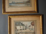 two framed paintings on a wall of a house and a street