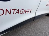 a close up of a white car with the word contagies written on it