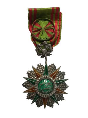 l'image d'une médaille surmontée d'une étoile