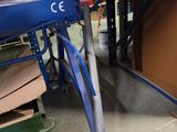 an image of a machine that is working on a piece of wood