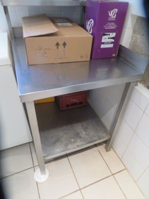 a metal table with a box on top of it