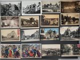 many old photographs of people and buildings on the wall
