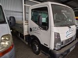 a white truck that is parked in a garage