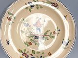 a plate with a design on it next to a plate with a design on it