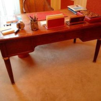 a desk with a chair and a chair in the room