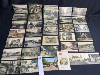 several old black and white photographs of a town and a street
