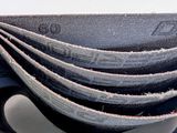 a stack of sanded belts stacked on top of each other
