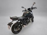 the motorcycle is parked on a white surface with a gray background