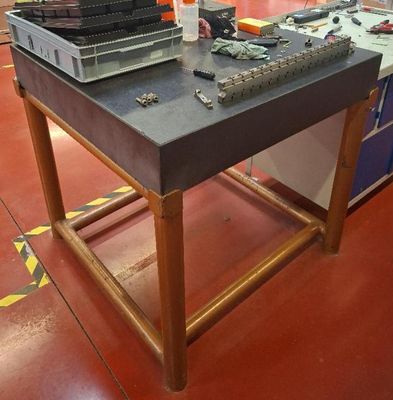 a workbench that has a bunch of tools on it