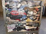 a metal cart filled with lots of items in a warehouse