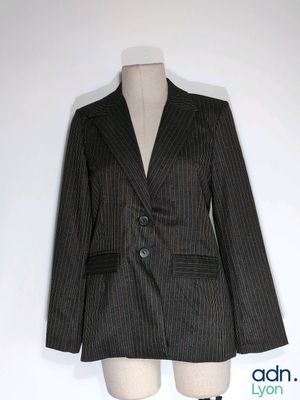 a black and white striped jacket on a mannequin dummy