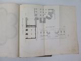 an open book with a drawing of a floor plan in it