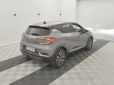 a picture of a grey car parked in a garage