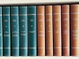 many books that are on a shelf in the room