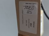 a wooden stick with a tag attached to it
