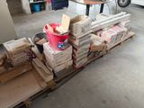 a pile of boxes sitting on a pallet in a garage
