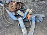 a hose and a hose on the ground next to a car
