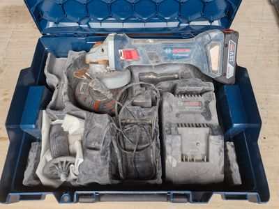a blue tool case with tools in it on a table