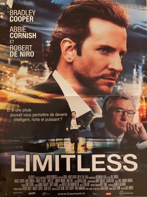une affiche du film « Limitless » mettant en scène un homme en costume-cravate