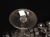 many empty wine glasses sitting on a table