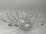 a clear glass bowl with a flower design on it
