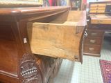 a wooden desk with a drawer underneath it