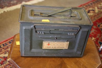 an old radio sitting on top of a wooden table