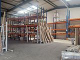 a large warehouse filled with lots of shelves and pallets