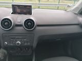 a dashboard of a car with a digital display on it