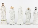 five figurines of jesus and mary on a white background