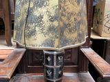 a lamp that is sitting on a chair in a room