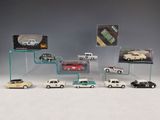 a lot of cars that are on display in a display case