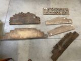 several pieces of wood sit on the floor in a room