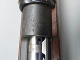 an old gun with a wooden barrel and a metal handle