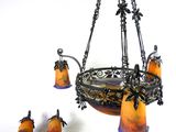 a chandelier that has a bunch of candles on it