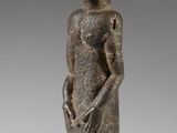 an image of a statue of a woman standing on a pedestal