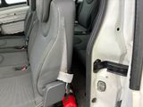 a seat in the back of a van with a fire hydrant in it