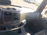 a dashboard of a car with a steering control