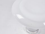 a close up of a white plate on a white surface