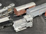 five toy trains sitting next to each other on a table
