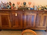 a wooden cabinet with a mirror on top of it