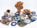 a pile of different types of stones on a white surface