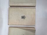 three pieces of paper on a table with a stamp on them